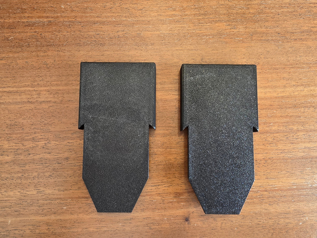 The pair of Stroller House lower-slot basket brackets in textured matte black