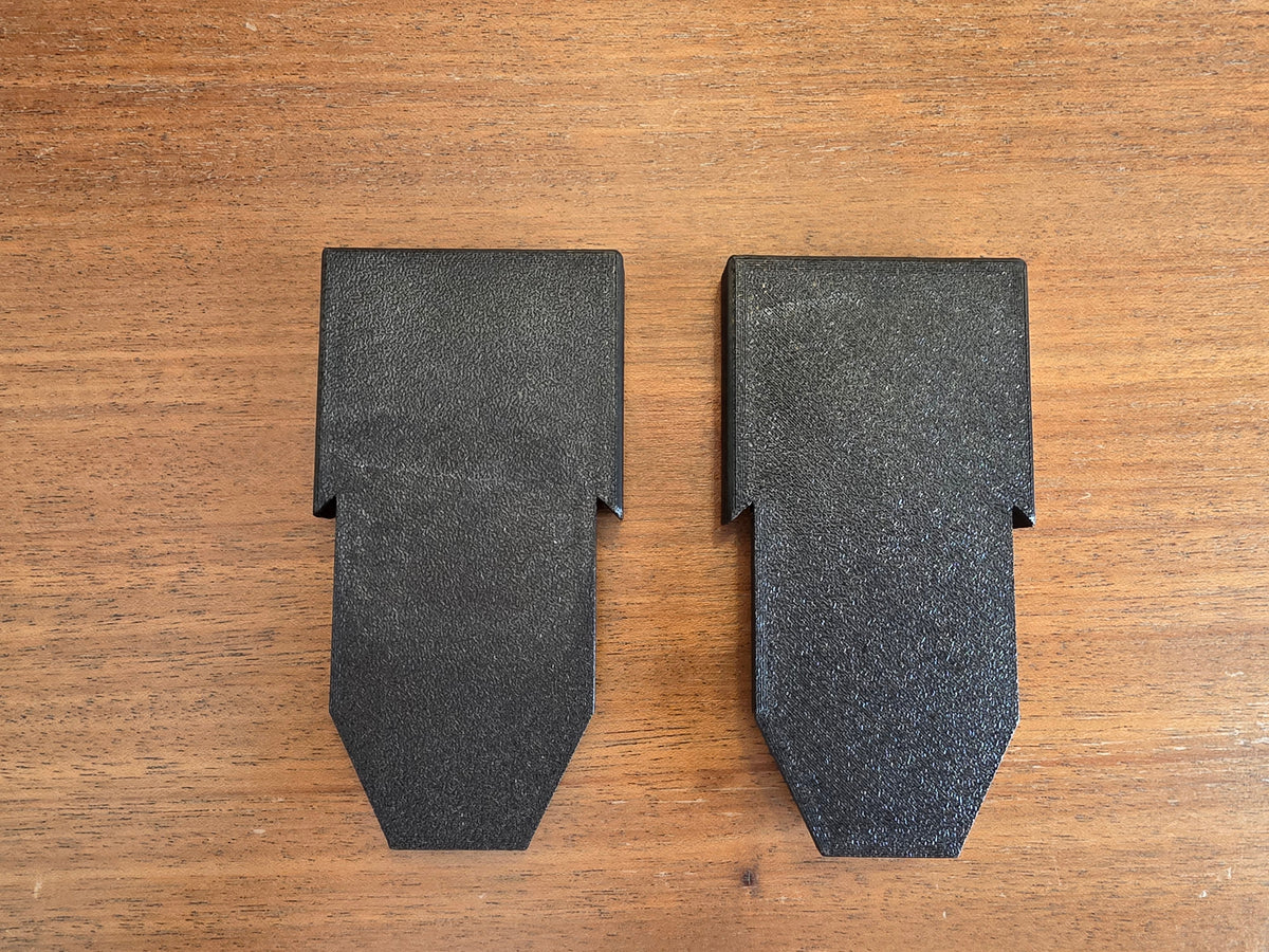 The pair of Stroller House lower-slot basket brackets in textured matte black