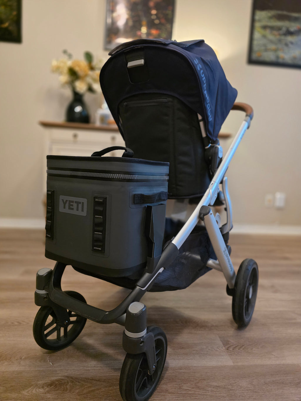 Rear view of an UPPAbaby Vista with a charcoal YETI Hopper Flip 12 mounted low and inside the wheelbase, where hanging weight belongs